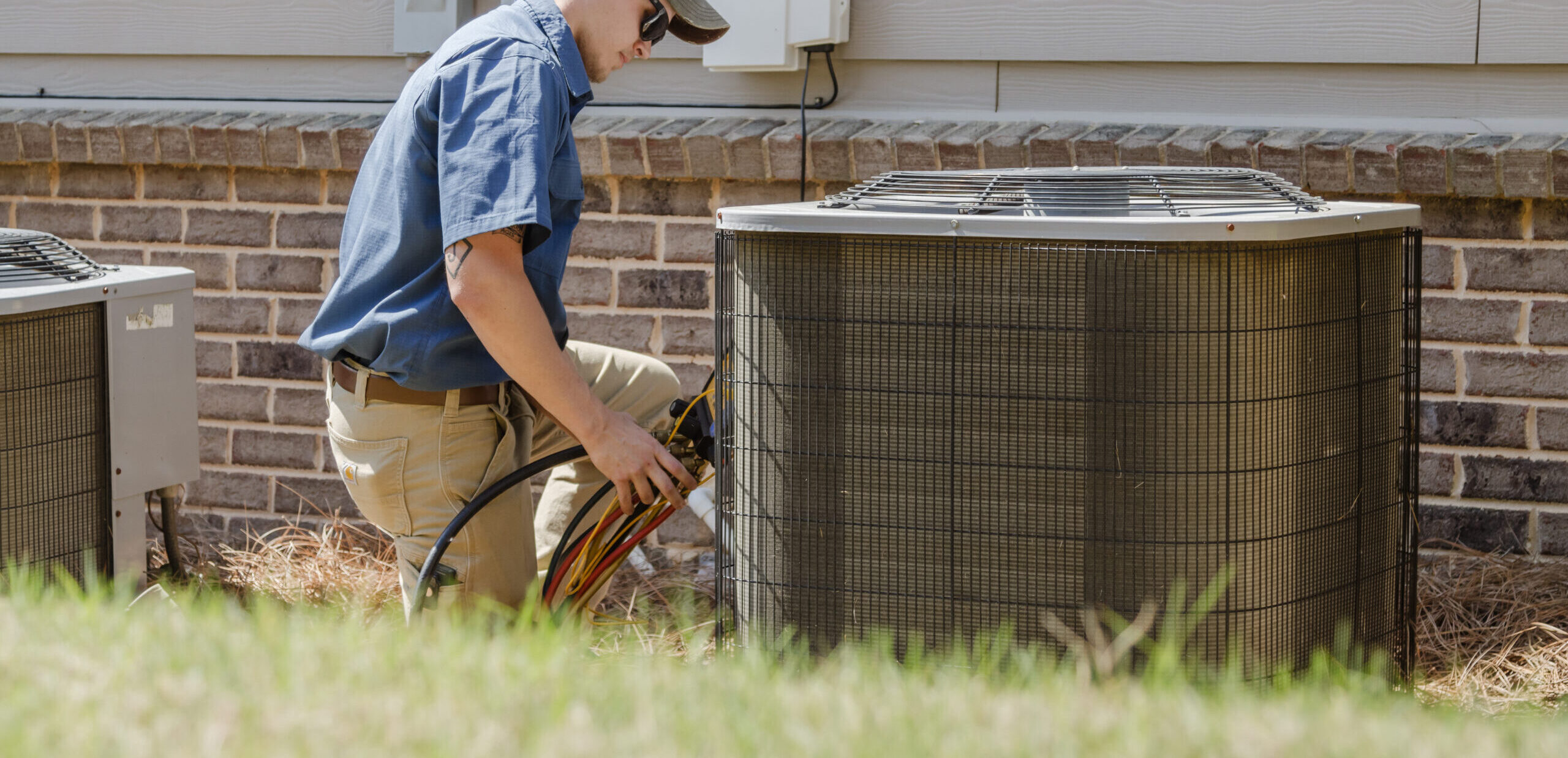 Professional setting up an energy-efficient HVAC system.